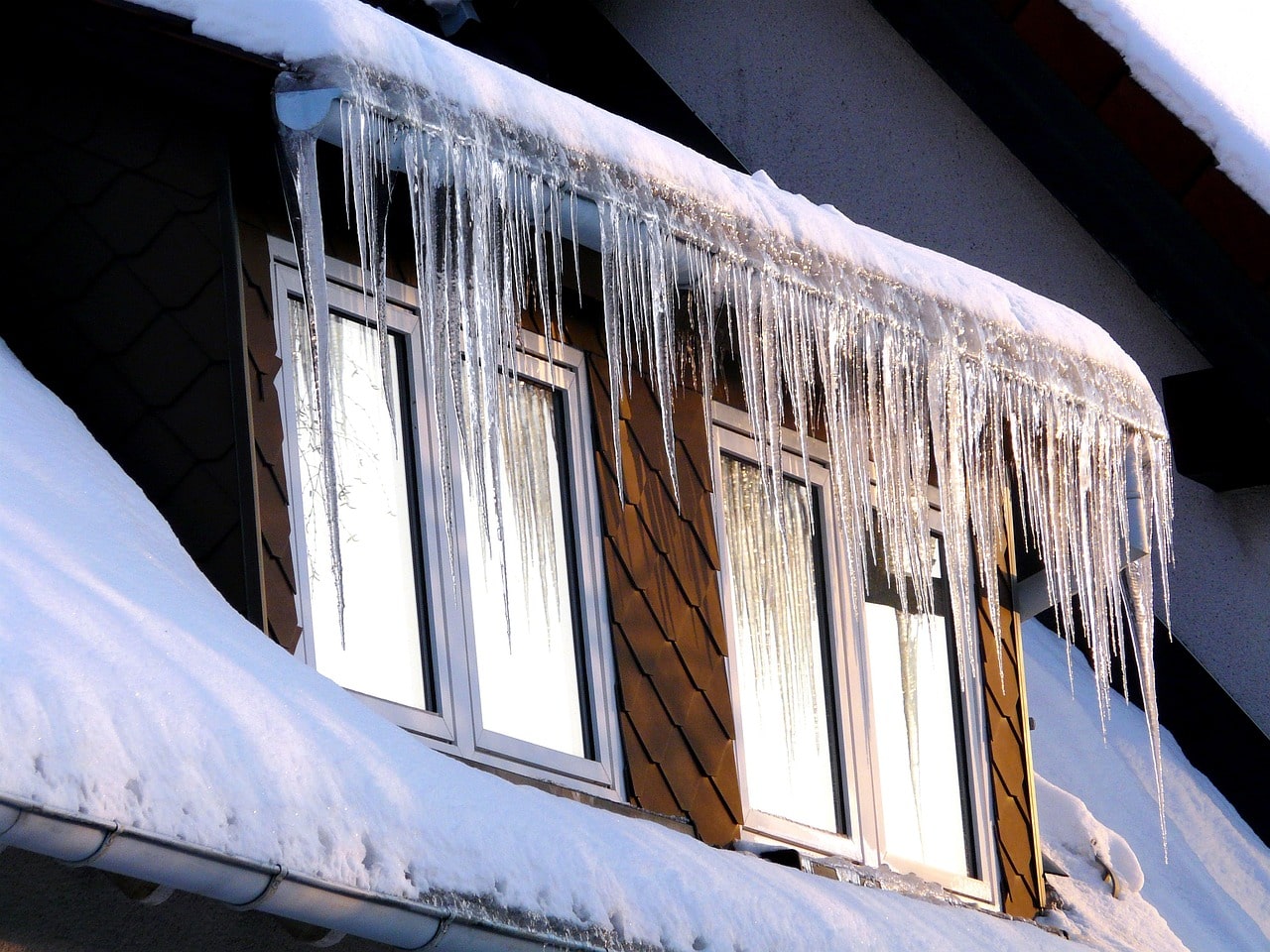 Tips on How to Remove Ice Dams From Your Roof Safely - Pine Tree Exteriors